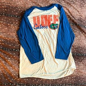 The Victory, Large, white with blue sleeves and gators logo.